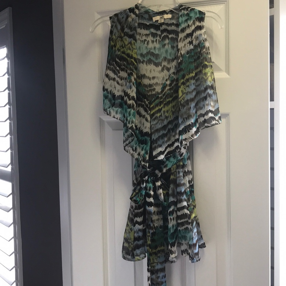 Belted blouse with ruffle neck line